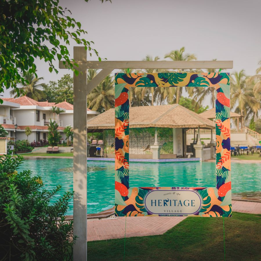 Swimming pool at Heritage Village Resorts &amp; Spa Goa, an Insta-ready spot for poolside relaxation.