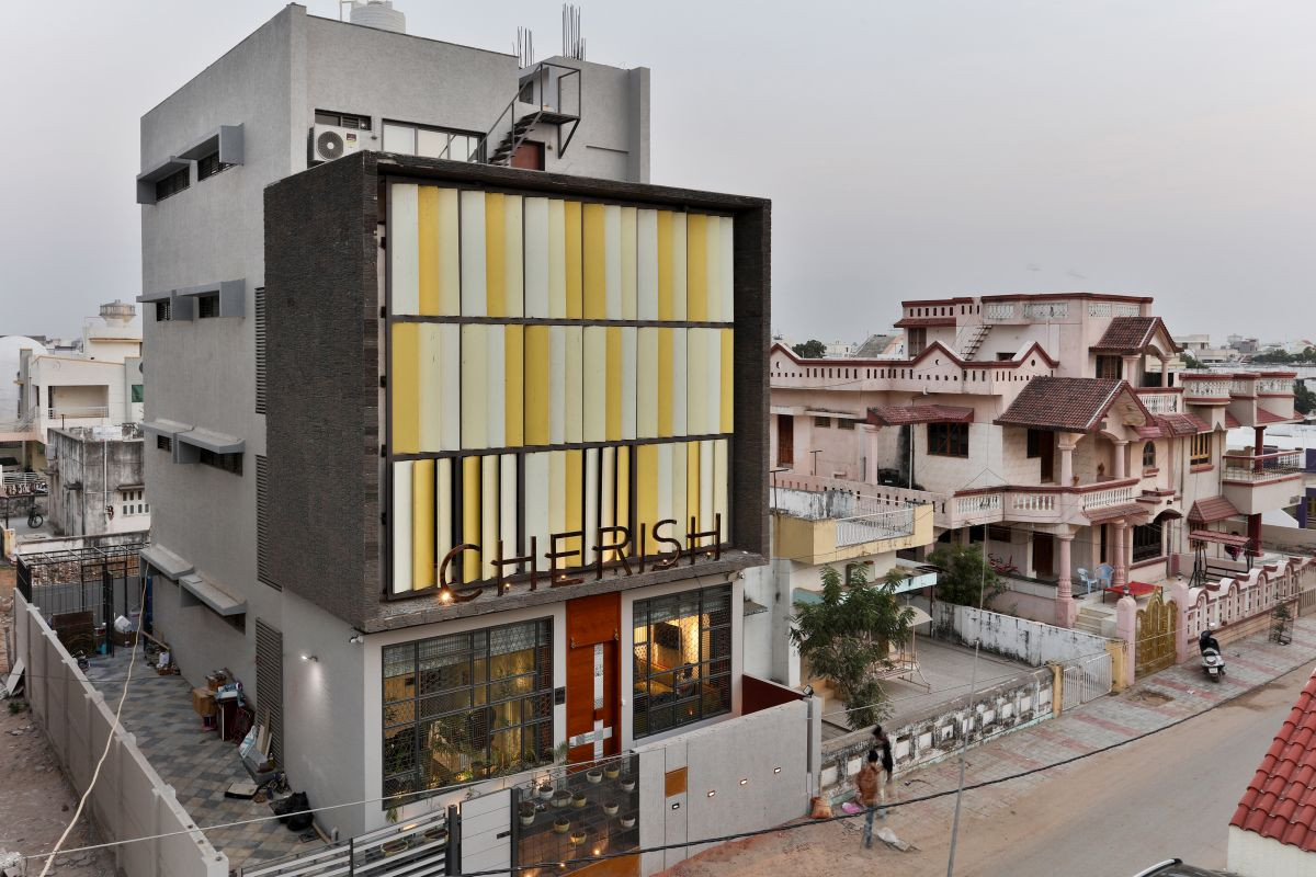 Exterior view of The Cherish Spa & Salon House in Himatnagar showcasing its unique facade and window slits for privacy