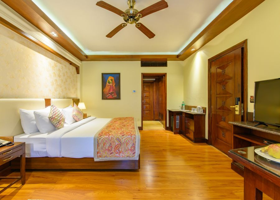 alt-text Interior of a well-decorated room at Ananta Pushkar with a double bed and work desk