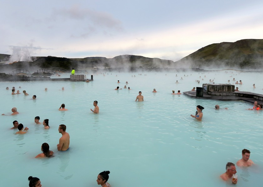 Blue Lagoon Iceland at dusk with steam rising from the water