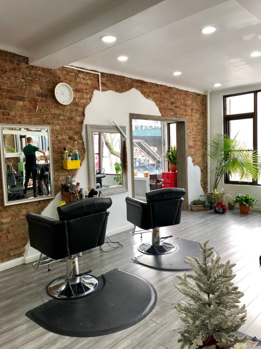 alt text: Interior of Art Room Hair Spa with stylish decor and comfortable seating.