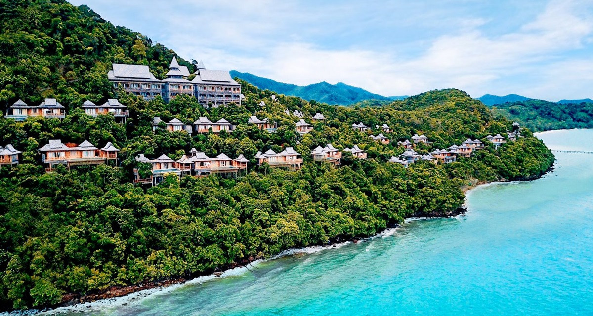 alt text: Aerial view of Santhiya Koh Yao Yai Resort & Spa showcasing traditional Thai architecture and lush landscaping.