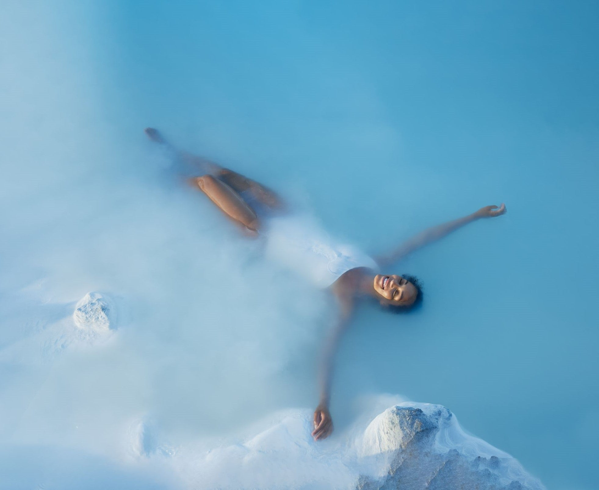 Immerse yourself in the soothing milky blue waters of Iceland's Blue Lagoon geothermal spa