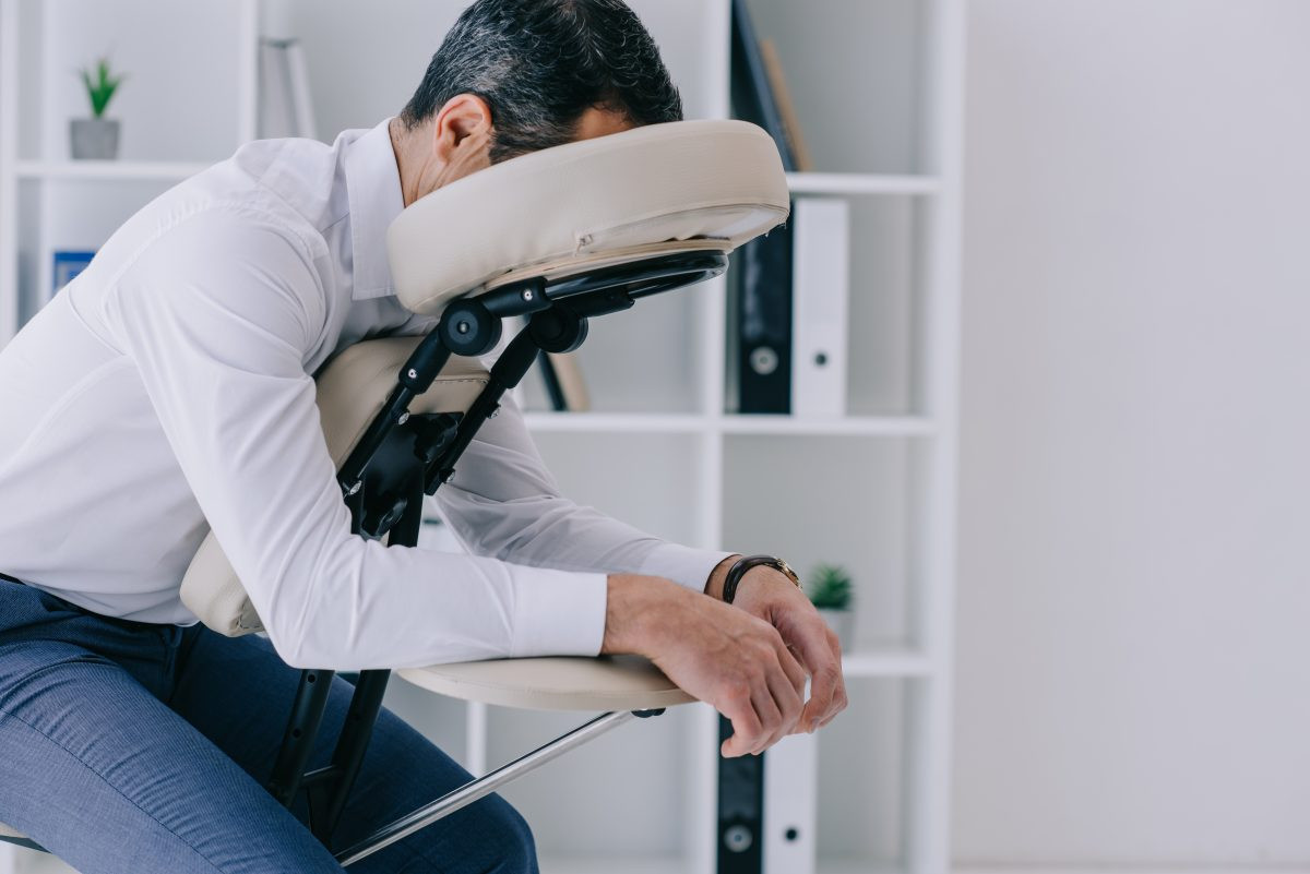 Relaxing chair massage at a spa, ideal for relieving neck and upper back tension. A quick and effective spa treatment.