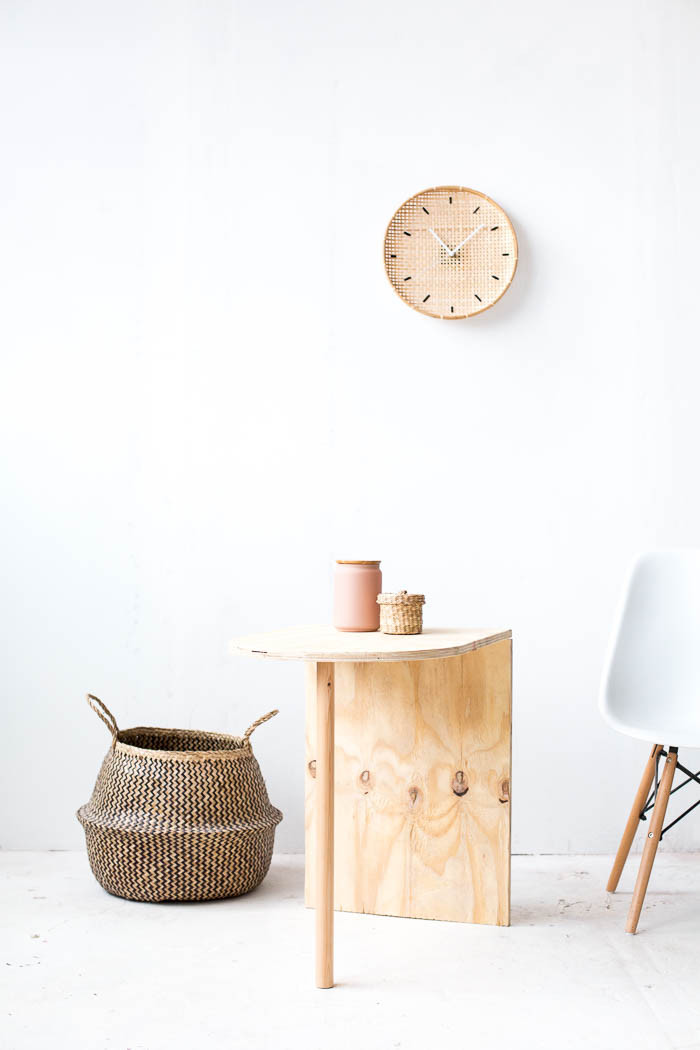 Person sanding wooden furniture, focusing on woodworking and craftsmanship.