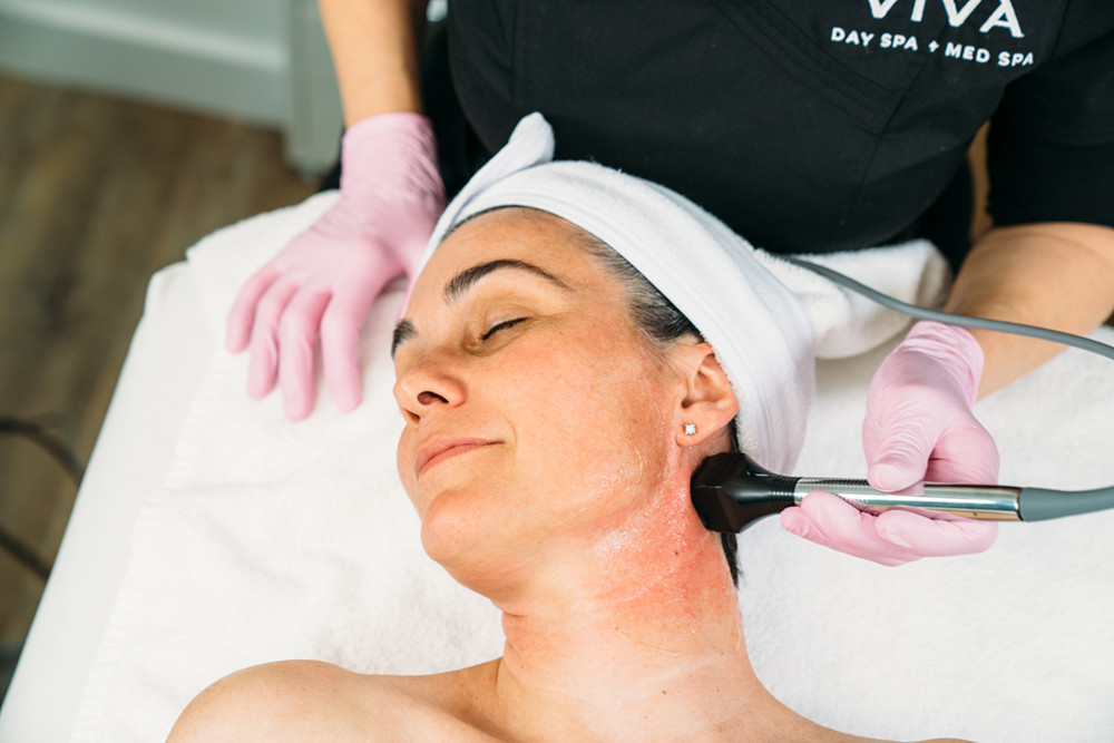 Woman receiving Forma skin tightening treatment at Viva Day Spa in Austin Texas.