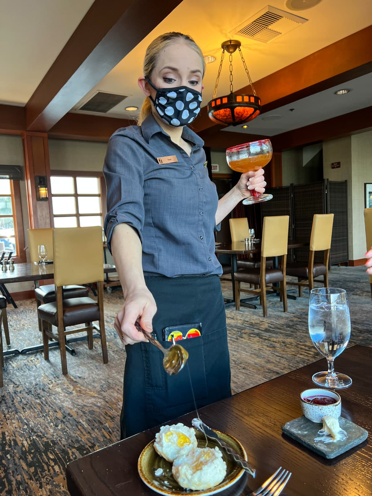 Honey being poured onto a biscuit at Salish Lodge & Spa Snoqualmie WA