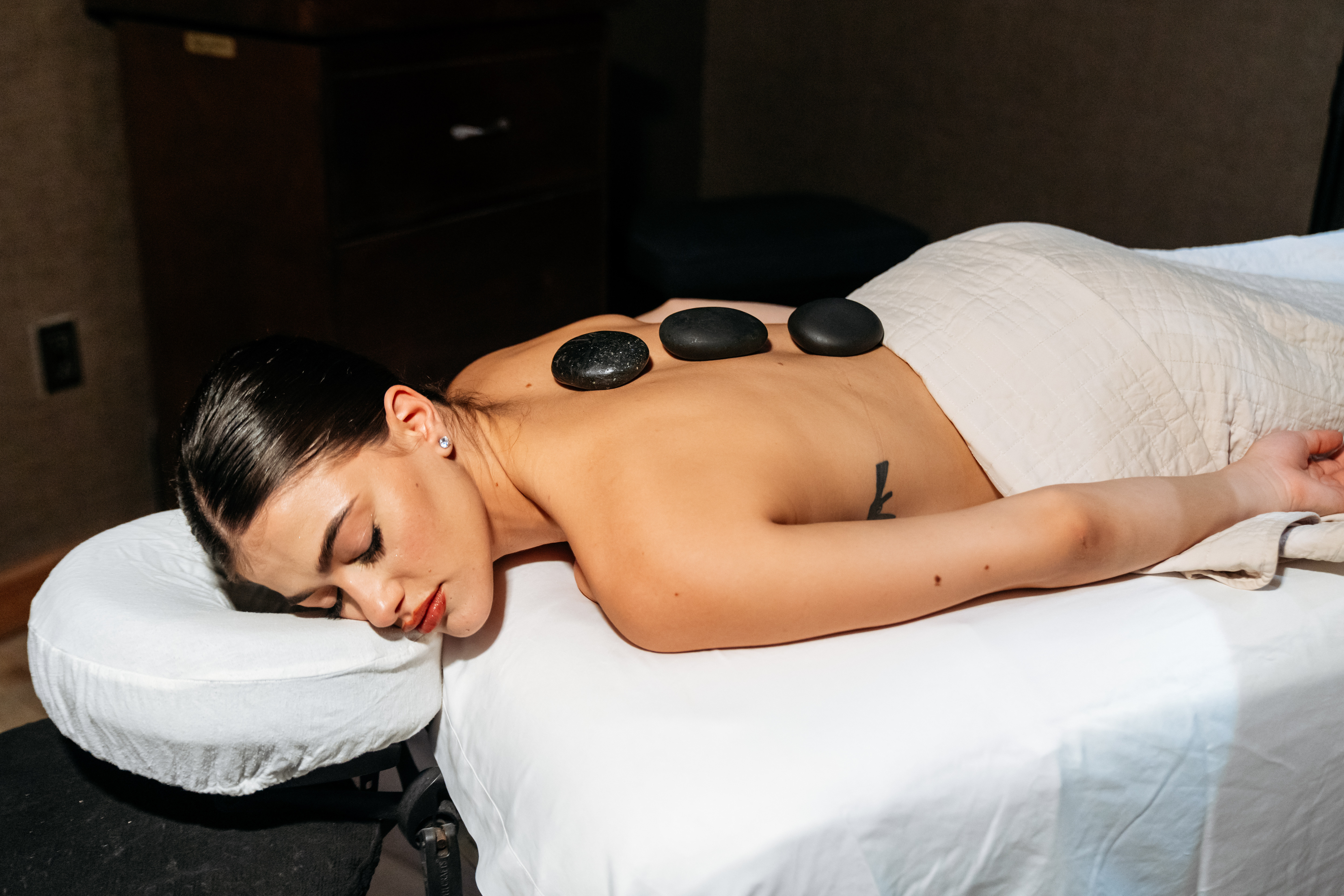 Woman getting a hot stone massage