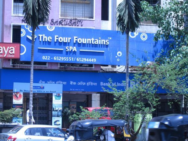 Welcoming reception area of Four Fountains Spa in Pune, highlighting a comfortable seating arrangement and serene ambiance, perfect for initiating a relaxing spa experience.