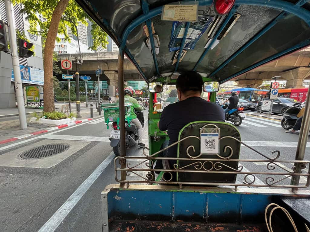 Traveler enjoying Bangkok tuk-tuk ride