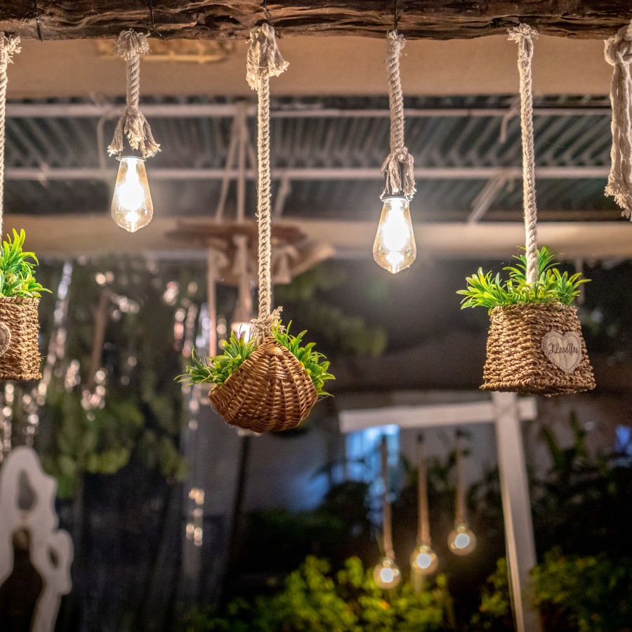 Mama Miso garden decor at Heritage Village Resorts &amp; Spa, Goa, showcasing the restaurant's garden ambiance.