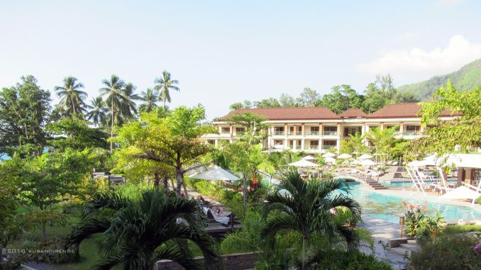 Exterior view of Savoy Seychelles Resort & Spa showcasing its modern architecture and tropical surroundings, ideal for luxury vacations.