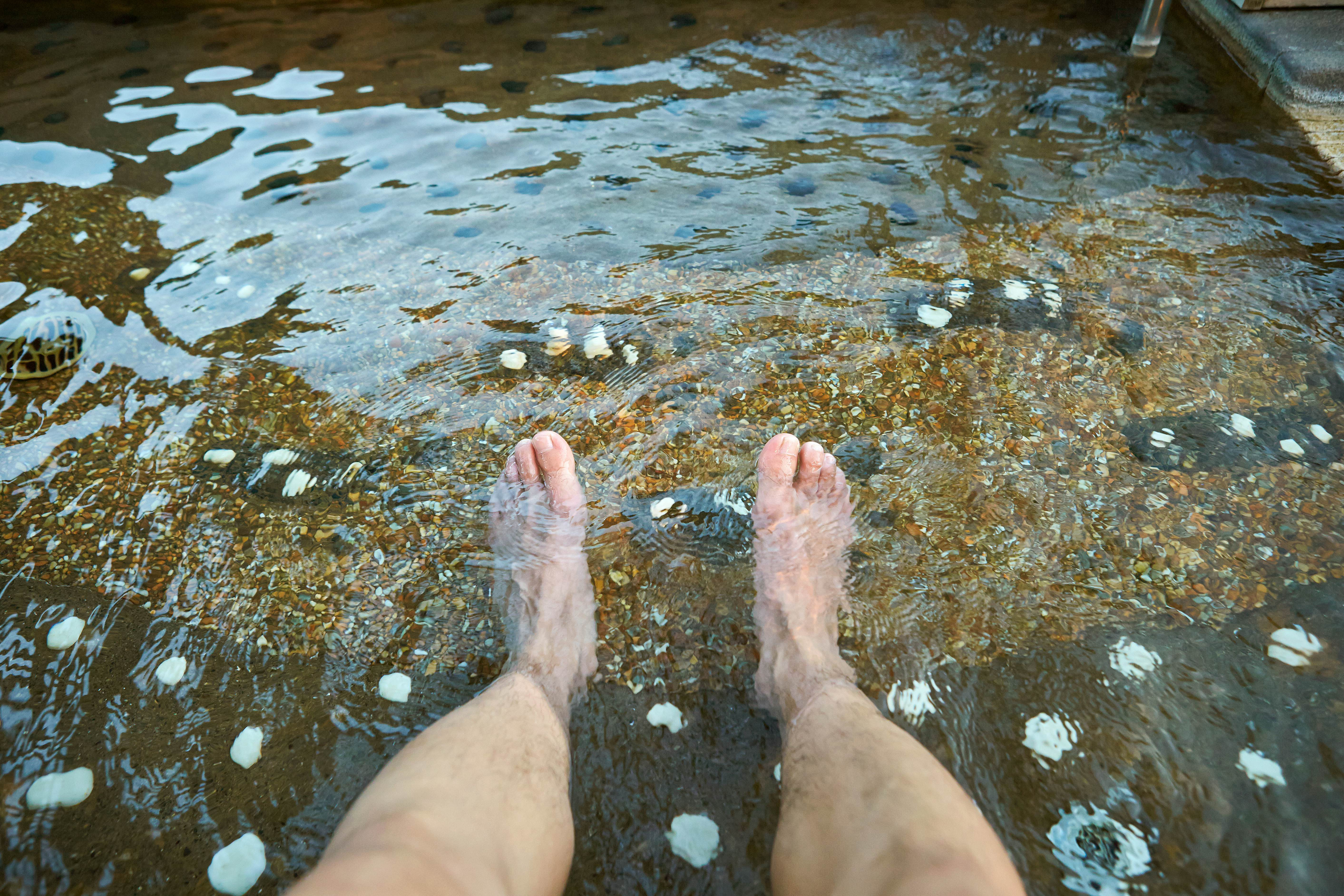 A man soaking in a spa bath in South Korea