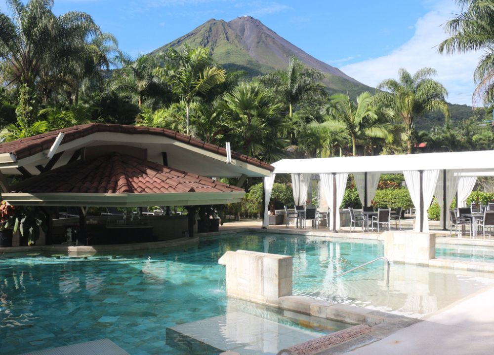 The Royal Corin Thermal Water Spa and Resort, Costa Rica, showcasing its luxurious exterior and lush landscaping.