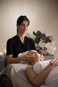 Relaxing facial massage at Alizi Spa in Ambience Mall Gurgaon, offering a serene escape from city life.