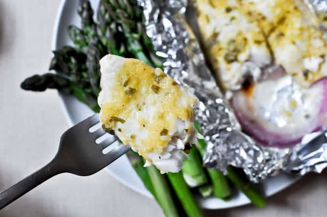 Grilled tilapia with peaches in foil packets.