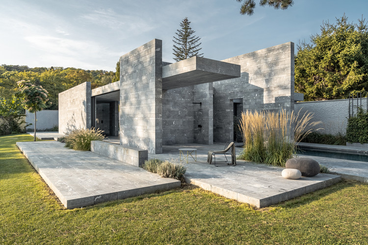 Exterior view of Spa Pavilion with lush greenery and natural stone
