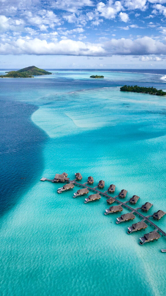 Overwater bungalow at Bora Bora Pearl Beach Resort with direct access to the turquoise lagoon